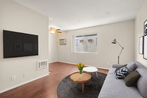 A living room with a couch and a coffee table