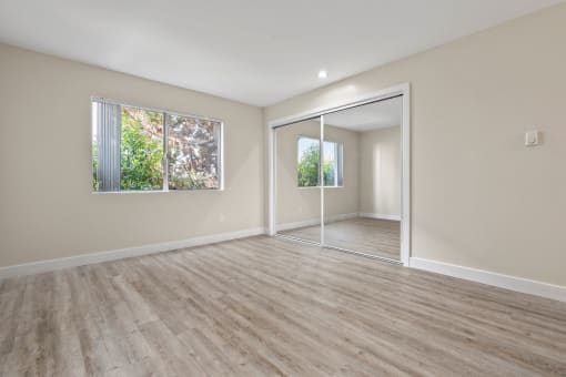 Bedroom with Hardwood Flooring and Natural Light at Parkway Terrace Apartments, Culver City