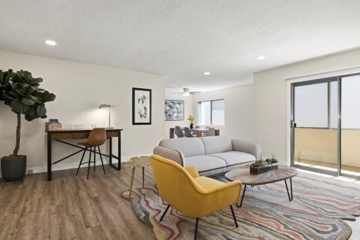 a living room with a couch and a desk