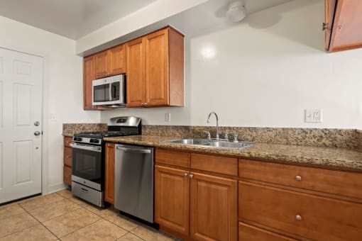 a kitchen with a sink and a counter top