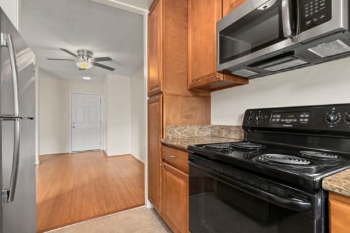 Krystal Terrace Apartments in Sherman Oaks, CA stainless steal appliances stove and microwave