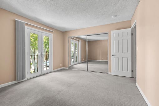 Bedroom with Mirrored Closets and Balcony at The Meadows at The Meadows at Westlake Village Apartments, Westlake Village, CA 91361