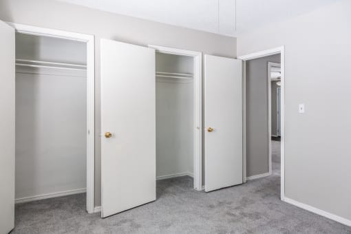 bedroom with walk-in closets