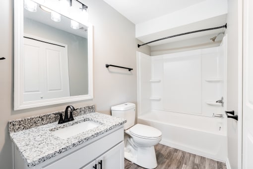 Renovated bathroom with granite counter