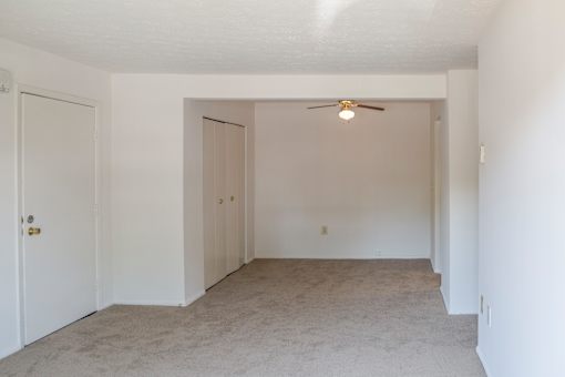 A room with a ceiling fan and carpeted floor at Hummingbird Pointe & The Gardens, Parma, OH 44129