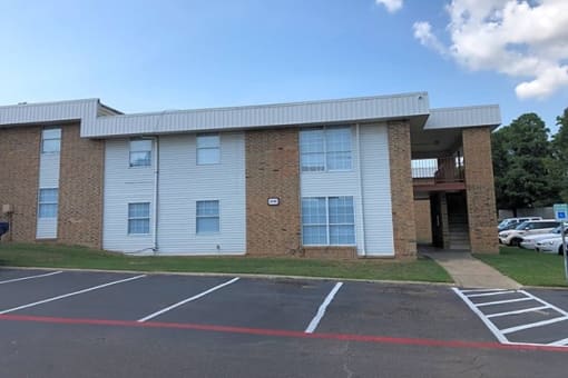 a view of the front of the building from the parking lot