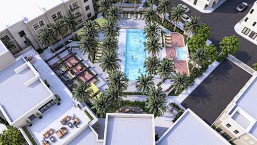 an aerial view of an apartment complex with a swimming pool and palm trees