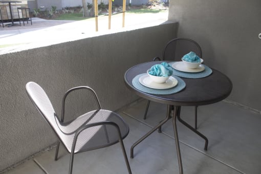 a table and chairs on a balcony  at The Crossings at Redlands, Redlands, CA