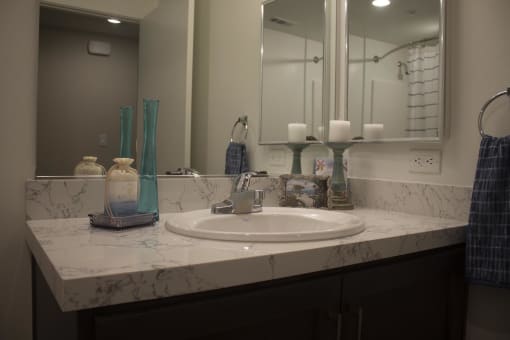 a bathroom with a sink and a mirror at The Crossings at Redlands, Redlands, CA