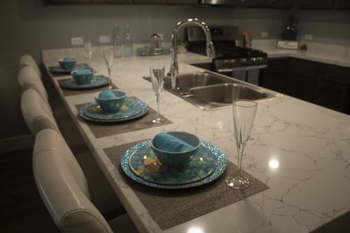 a kitchen with a sink and a counter top  at The Crossings at Redlands, California