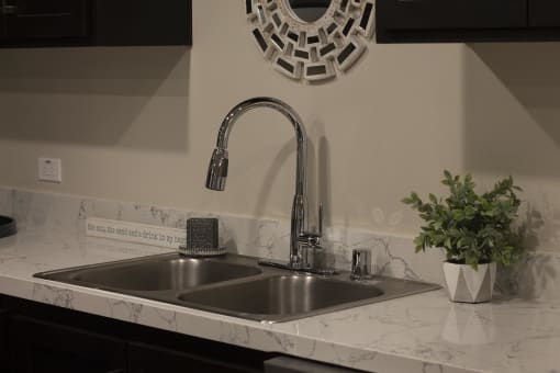 a kitchen sink with a chrome faucet at The Crossings at Redlands, California
