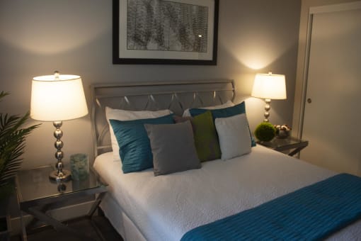a bedroom with a bed and two nightstands at The Crossings at Redlands, Redlands, 92374