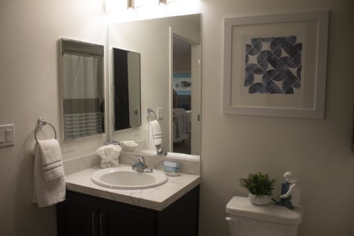 a small bathroom with a sink and a toilet at The Crossings at Redlands, Redlands, California