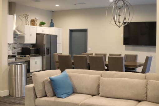 a living room filled with furniture and a large window at The Crossings at Redlands, Redlands, CA, 92374