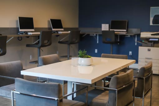 a room filled with desks and chairs and computers at The Crossings at Redlands, Redlands, California