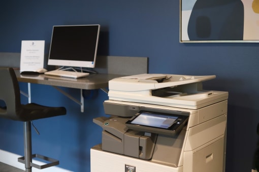 a printer and a computer on a desk in an office at The Crossings at Redlands, Redlands, California