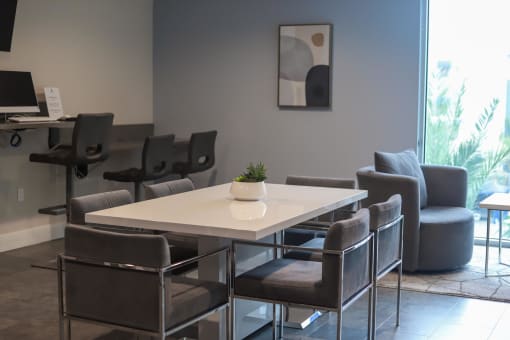 a room with a table and chairs at The Crossings at Redlands, Redlands