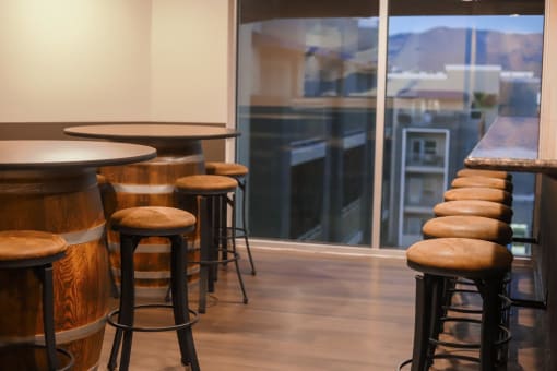 a bar with stools and a window with a view at The Crossings at Redlands, Redlands, California