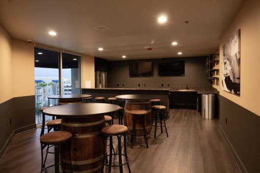 a bar area with stools and tables at The Crossings at Redlands, Redlands