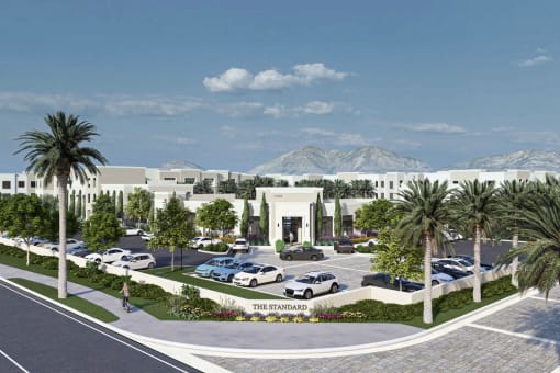 an aerial view of a parking lot with palm trees