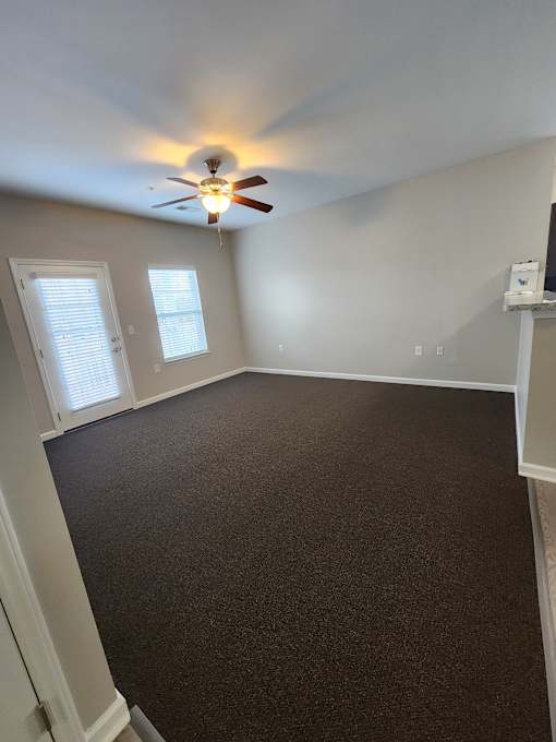 Spacious Living Room with Ceiling Fan  at The Assembly Apartments, Greenville