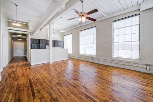 Living room with wooden floors at Asheboro Mill Lofts, Asheboro
