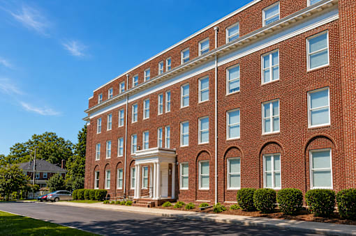 A red brick building with white trim and windows.