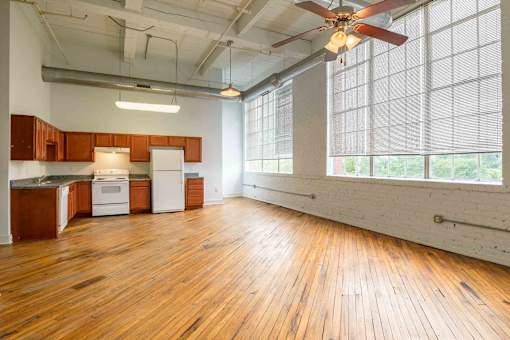 Room with ceiling fan at Kemper Lofts Apartments, Lynchburg, VA