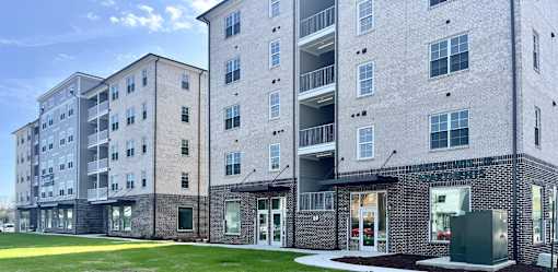 Apartment building with a grassy area at James Lewis Jr, Charleston 