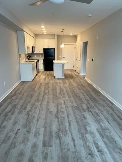 Living Room Come Kitchen View at Poland Hill Senior Apartments, Chantilly