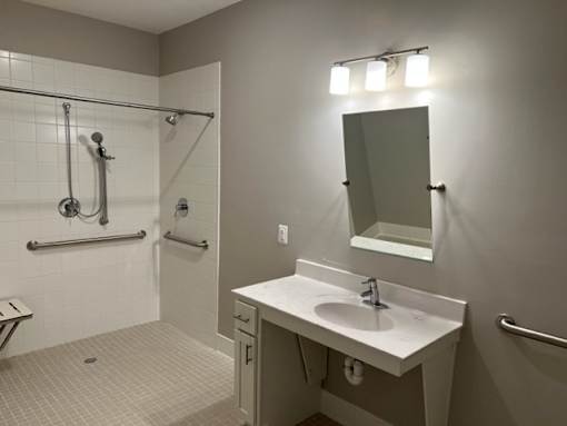 Bathroom with sink and shower at Poland Hill Senior Apartments, Virginia, 20152