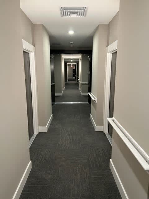 Carpeted hallway at Poland Hill Senior Apartments, Chantilly, VA, Virginia