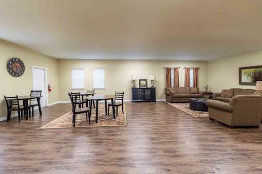 A living room with a wooden floor and furniture. at The Shire Apartments, Chesapeake, VA, 23325