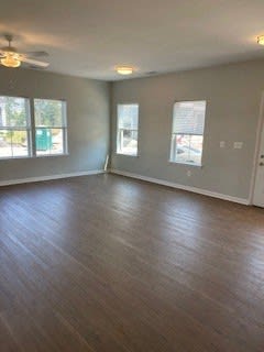 an empty living room with a hard wood floor at Braddock Terrace, Aldie