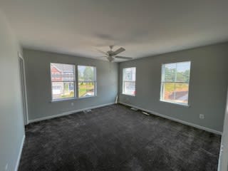 an empty living room with a ceiling fan at Braddock Terrace, Aldie, VA 20105