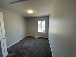 an empty room with a window and a carpet floor at Braddock Terrace, Aldie, 20105