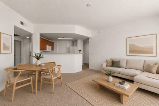 A living room with a dining table and a couch.