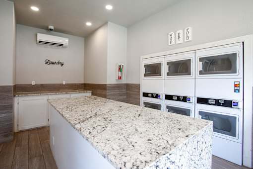 A laundry room with a washer and dryer.