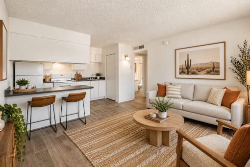 A modern kitchen with a bar stool and a dining table.