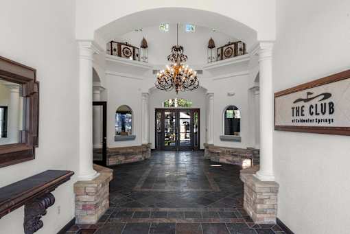 The Club at Old Town Springs has a grand entrance with a chandelier.