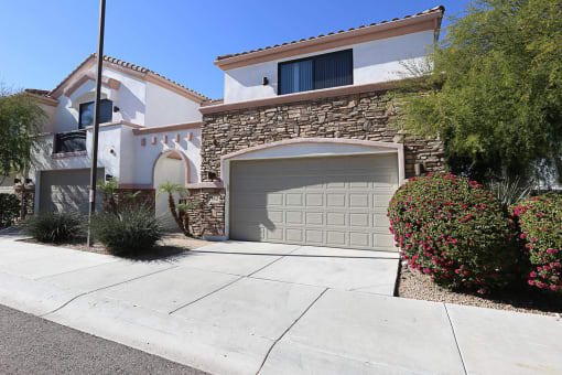 Exterior, Landscaping & Garage at Villa Contento Apartments in Scottsdale, AZ
