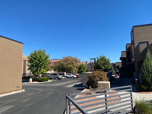 A parking lot with a metal gate in front of it.