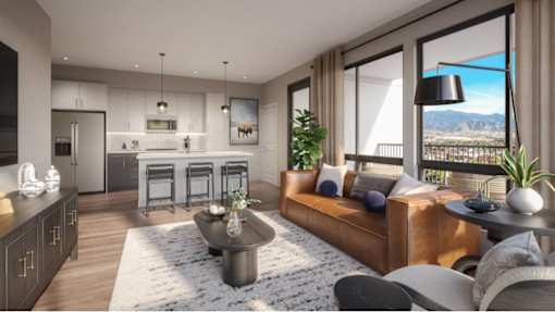 A modern living room with a large window overlooking a mountainous landscape.