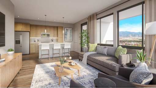 A modern living room with a view of the mountains.