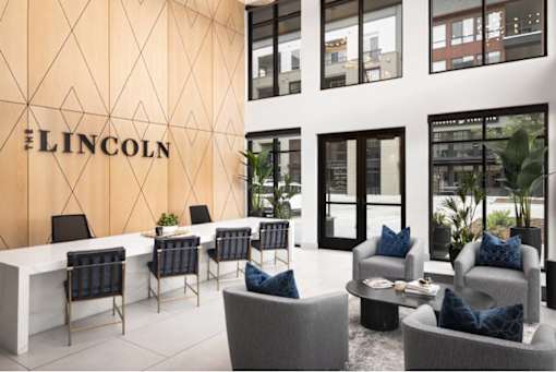 A modern office space with the word "LINCOLN" on the wall.