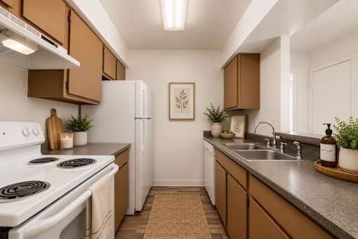 A kitchen with brown cabinets and a white stove.