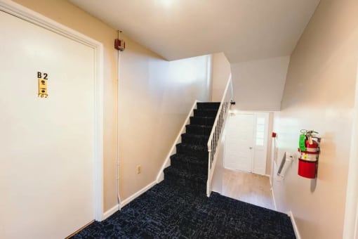 Living Area With Staircase at BAY SHORE APARTMENTS, Connecticut, 06512
