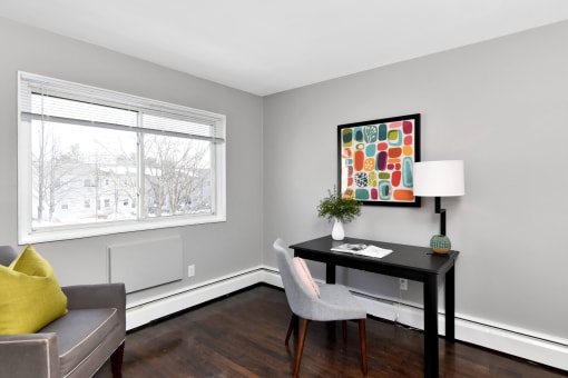a living room with a couch and a desk and a window at Encore 99, Connecticut, 06512