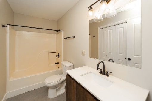a bathroom with a sink and a toilet and a shower at Retro 511 Apartments, West Haven