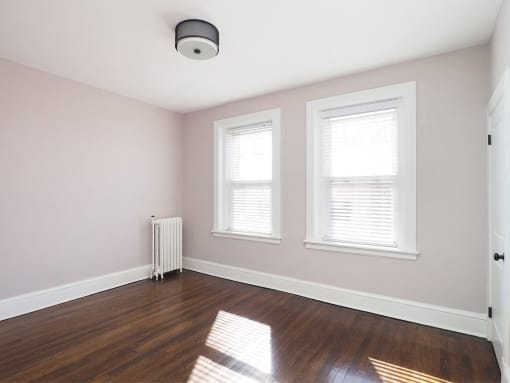 Room with window and wooden floor at The Packard, West Hartford